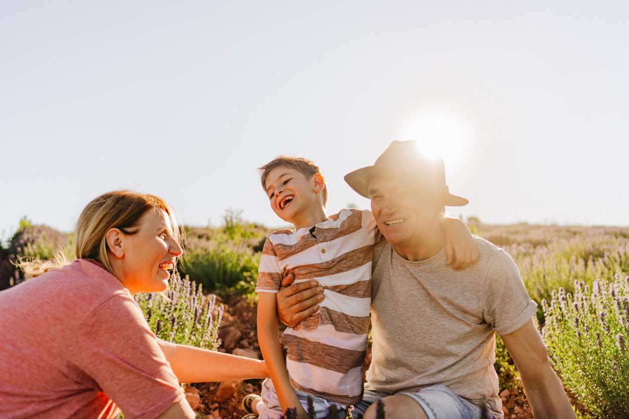 Photo of a little boy seeing his grandparents after long time in quarantine due to CoVid 19